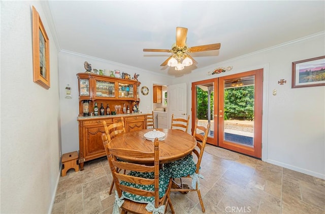 53235 Finegold Creek Ct, North Fork, CA 93643 - dining room featuring stone tile floors, crown molding, ceiling fan, washer / dryer, and french doors