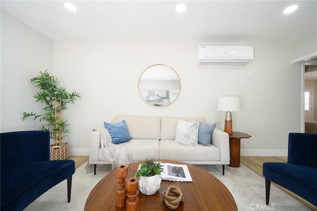 903 E 7th St, Pomona, CA 91766 - living area with a wall mounted air conditioner, recessed lighting, and light wood finished floors
