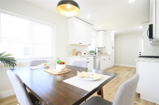 903 E 7th St, Pomona, CA 91766 - dining area with light wood-style floors and recessed lighting