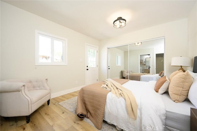 903 E 7th St, Pomona, CA 91766 - bedroom featuring light wood finished floors and a closet