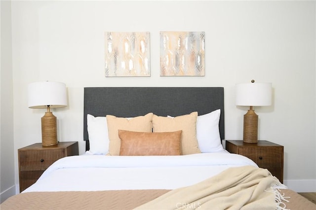 903 E 7th St, Pomona, CA 91766 - bedroom featuring baseboards