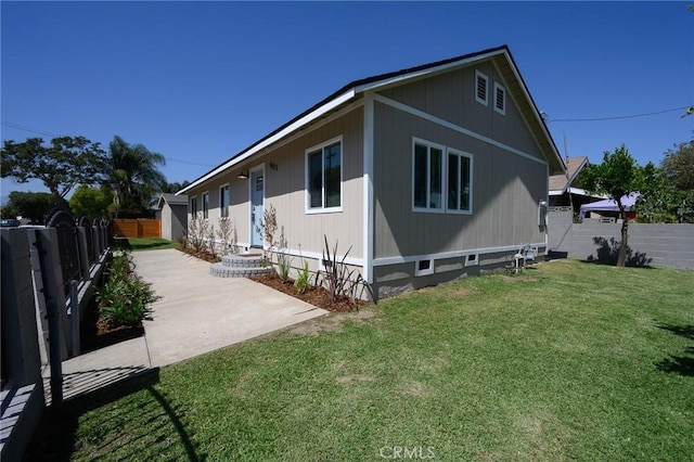 903 E 7th St, Pomona, CA 91766 - view of home's exterior with a fenced backyard and a patio