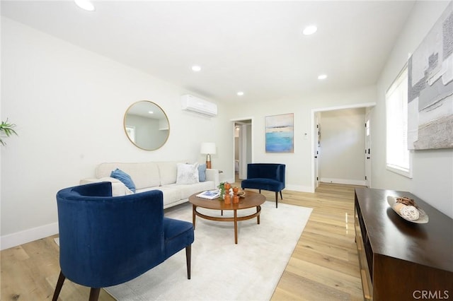 903 E 7th St, Pomona, CA 91766 - living room with a wall unit AC, recessed lighting, and light wood-style flooring