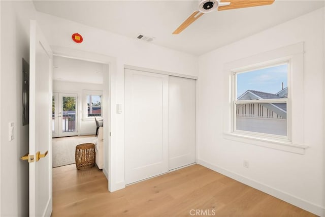 2842 Gunn St, San Diego, CA 92104 - unfurnished bedroom with light wood finished floors, a closet, and a ceiling fan