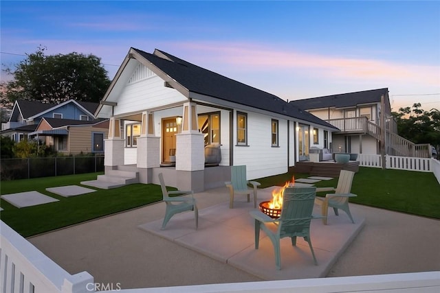 2842 Gunn St, San Diego, CA 92104 - back of house at dusk featuring a patio and an outdoor living space with a fire pit