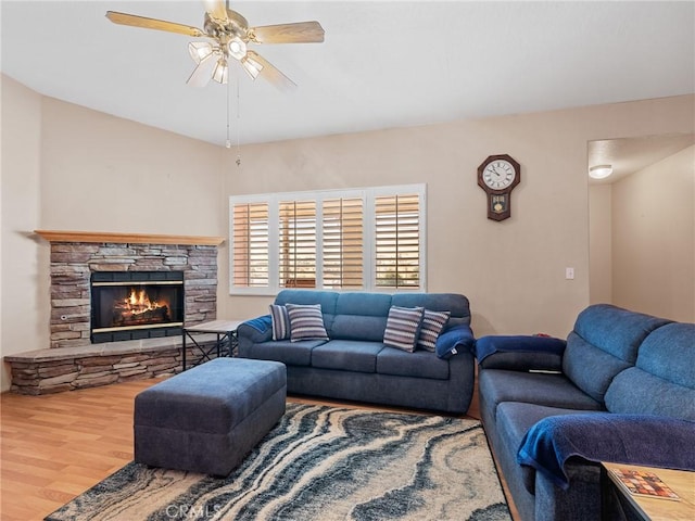 21756 Tussing Ranch Rd, Apple Valley, CA 92308 - living area with wood finished floors, a ceiling fan, and a fireplace