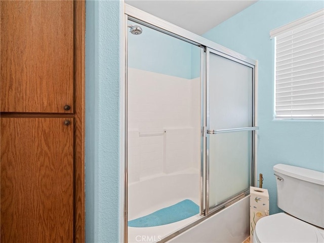 21756 Tussing Ranch Rd, Apple Valley, CA 92308 - bathroom with combined bath / shower with glass door and toilet