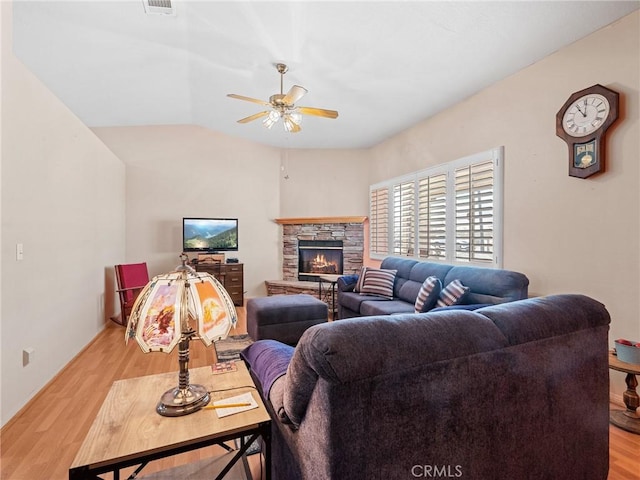 21756 Tussing Ranch Rd, Apple Valley, CA 92308 - living area with ceiling fan, light wood-type flooring, a stone fireplace, and lofted ceiling