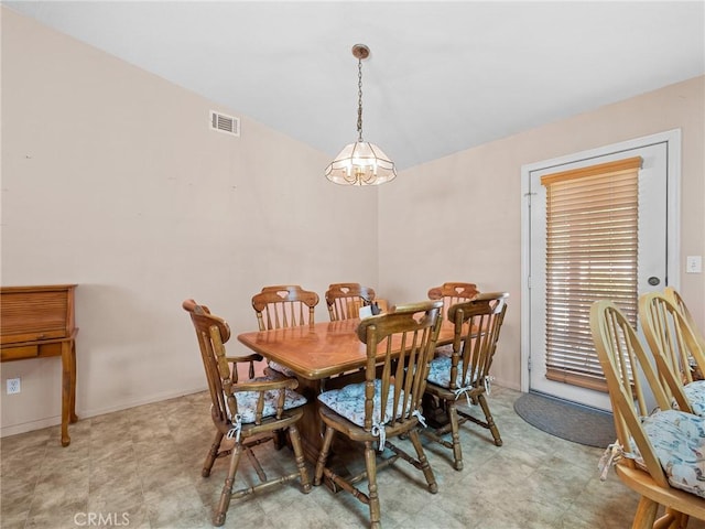 21756 Tussing Ranch Rd, Apple Valley, CA 92308 - dining area with light floors and a chandelier