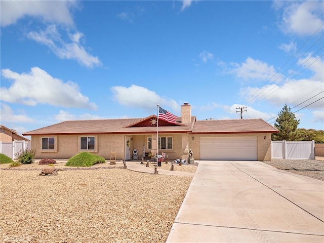 21756 Tussing Ranch Rd, Apple Valley, CA 92308 - ranch-style house featuring an attached garage, driveway, stucco siding, and a chimney