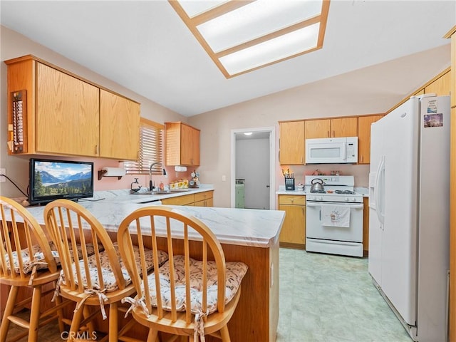 21756 Tussing Ranch Rd, Apple Valley, CA 92308 - kitchen featuring white appliances, a peninsula, light floors, lofted ceiling, and light countertops