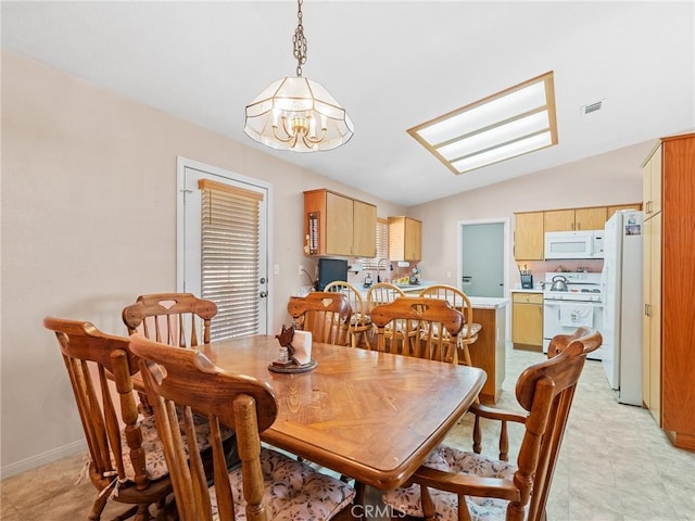 21756 Tussing Ranch Rd, Apple Valley, CA 92308 - dining space with lofted ceiling and a chandelier