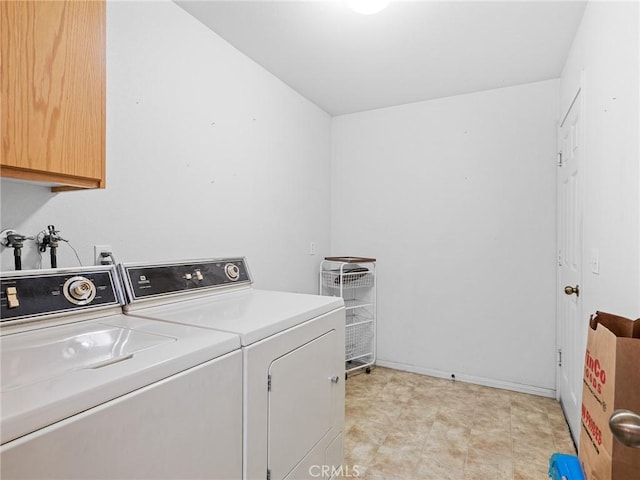 21756 Tussing Ranch Rd, Apple Valley, CA 92308 - laundry area with cabinet space and washing machine and dryer