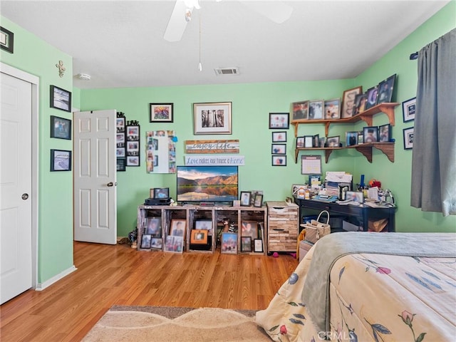 21756 Tussing Ranch Rd, Apple Valley, CA 92308 - bedroom featuring wood finished floors and ceiling fan