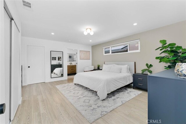 6242 E Pageantry St, Long Beach, CA 90808 - bedroom with light wood-type flooring, recessed lighting, and ensuite bathroom