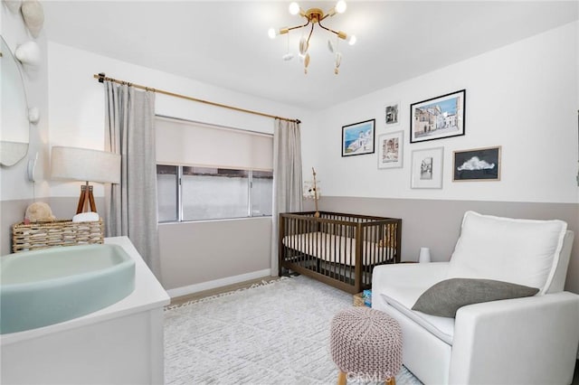 6242 E Pageantry St, Long Beach, CA 90808 - bedroom featuring a chandelier and baseboards