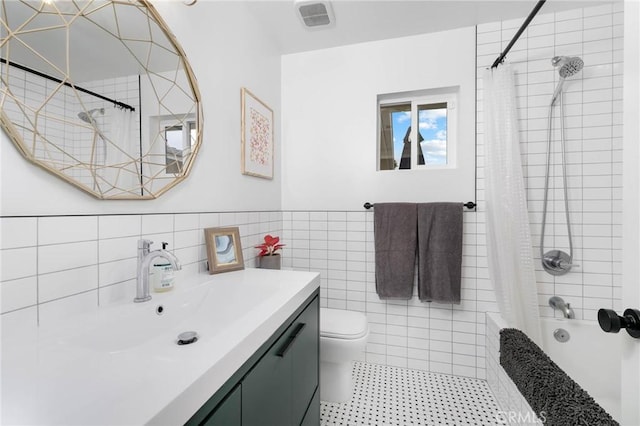 6242 E Pageantry St, Long Beach, CA 90808 - bathroom featuring vanity, shower / bathtub combination with curtain, tile walls, and a wainscoted wall