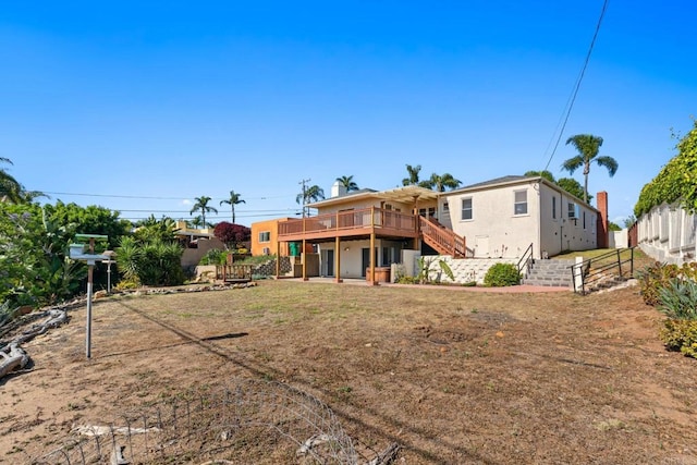 5038 Hastings Rd, San Diego, CA 92116 - back of property featuring stairs, a deck, and stucco siding