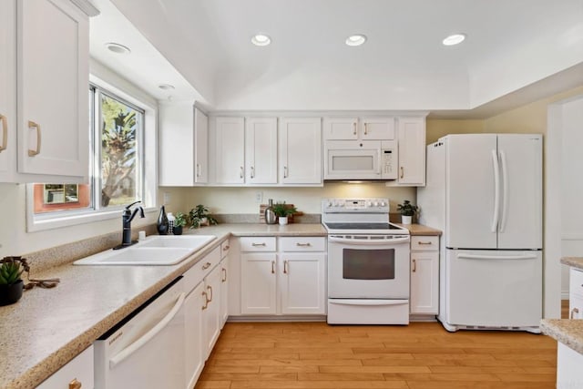 5038 Hastings Rd, San Diego, CA 92116 - kitchen with white appliances, white cabinetry, light countertops, light wood-style floors, and recessed lighting