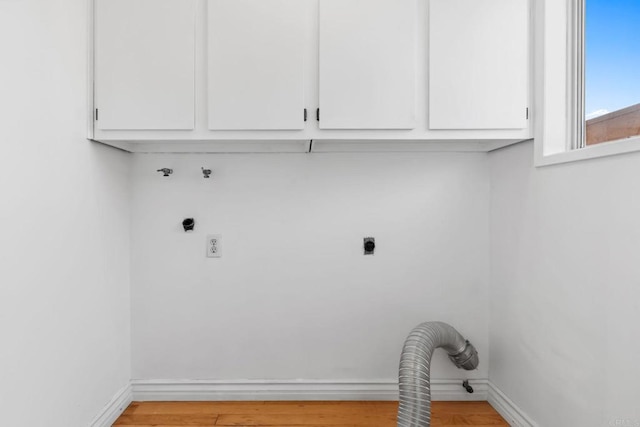 5038 Hastings Rd, San Diego, CA 92116 - washroom with hookup for an electric dryer, washer hookup, cabinet space, and light wood finished floors