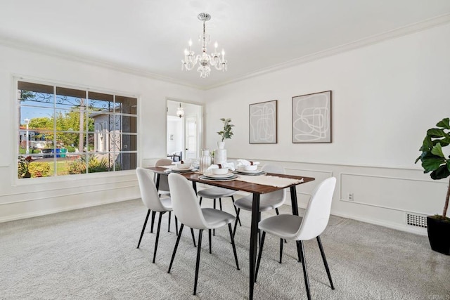 5038 Hastings Rd, San Diego, CA 92116 - carpeted dining space with a chandelier, crown molding, a decorative wall, and wainscoting