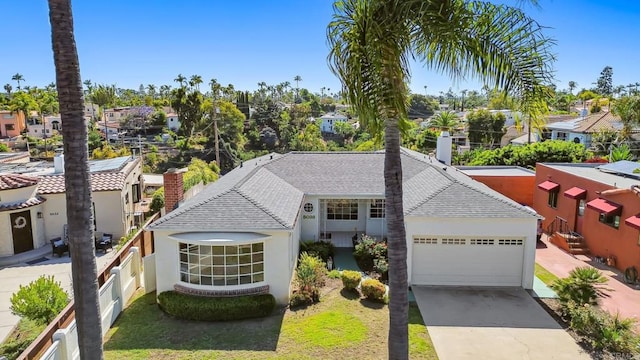 5038 Hastings Rd, San Diego, CA 92116 - view of front of home with a garage, driveway, roof with shingles, stucco siding, and a chimney