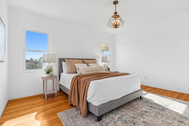 5038 Hastings Rd, San Diego, CA 92116 - bedroom featuring multiple windows and light wood-style floors
