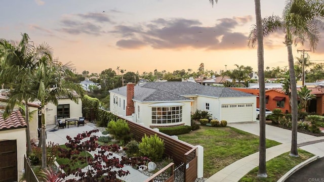 5038 Hastings Rd, San Diego, CA 92116 - view of front of property featuring an attached garage, concrete driveway, a residential view, a lawn, and stucco siding