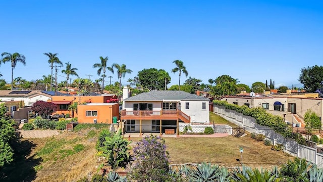 5038 Hastings Rd, San Diego, CA 92116 - back of house featuring a fenced backyard, a wooden deck, stucco siding, and stairs