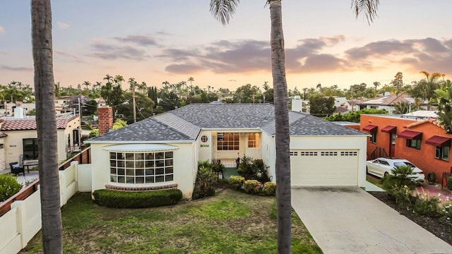 5038 Hastings Rd, San Diego, CA 92116 - view of front of property with an attached garage, driveway, stucco siding, and a shingled roof