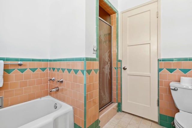 5038 Hastings Rd, San Diego, CA 92116 - bathroom with tile walls, a shower stall, a wainscoted wall, a bath, and tile patterned floors