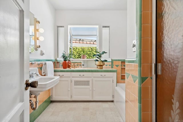 5038 Hastings Rd, San Diego, CA 92116 - full bath featuring tile walls, a bath, and wainscoting