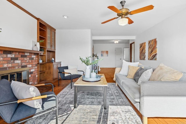 5038 Hastings Rd, San Diego, CA 92116 - living room with ceiling fan, a brick fireplace, and wood finished floors