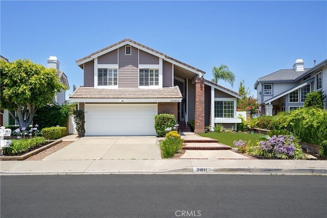 21811 Calatrava, Mission Viejo, CA 92692 - view of front of property featuring a garage, driveway, and a tile roof