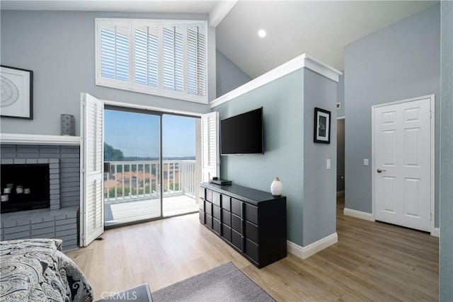 21811 Calatrava, Mission Viejo, CA 92692 - living room with high vaulted ceiling, wood finished floors, and a fireplace