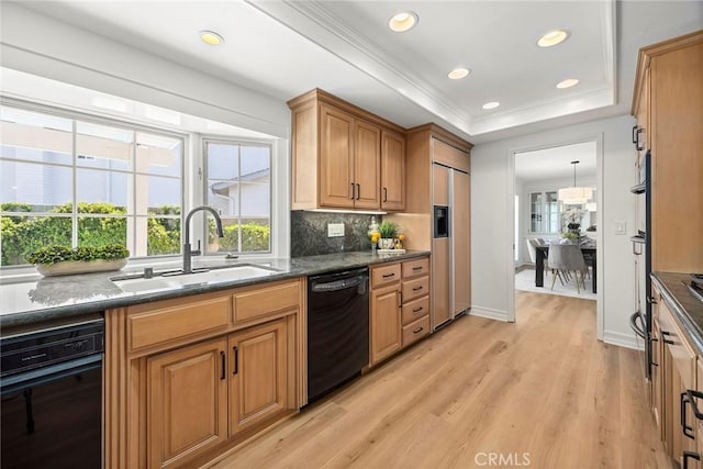 430 Kiolstad Dr, Placentia, CA 92870 - kitchen featuring dishwasher, paneled built in refrigerator, decorative backsplash, light wood-style floors, and a raised ceiling