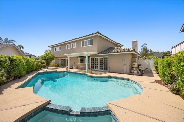 430 Kiolstad Dr, Placentia, CA 92870 - view of pool with a patio area, a fenced backyard, and a pool with connected hot tub