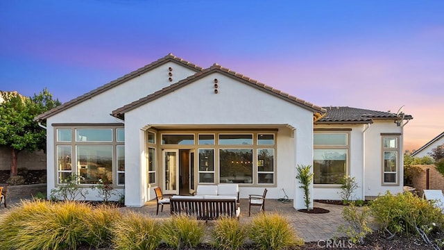 1849 Eucalyptus Rd, Nipomo, CA 93444 - back of property featuring an outdoor living space, stucco siding, and a patio