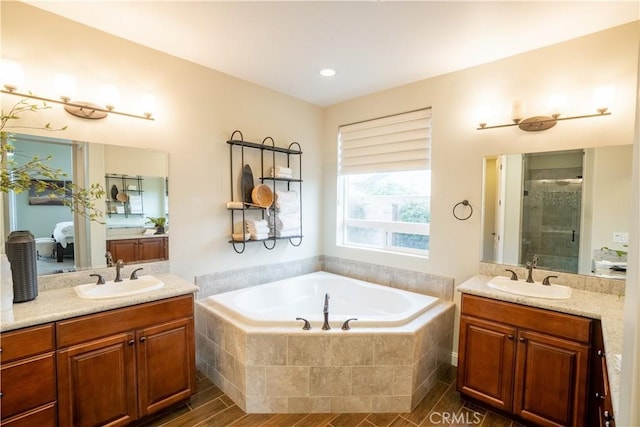 1849 Eucalyptus Rd, Nipomo, CA 93444 - bathroom with a stall shower, a garden tub, two vanities, and wood finished floors