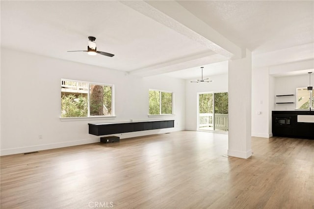 30260 Gremlin Ct, Running Springs, CA 92382 - unfurnished living room featuring wood finished floors, a chandelier, and a ceiling fan