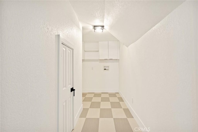 30260 Gremlin Ct, Running Springs, CA 92382 - hall featuring a textured ceiling, a textured wall, light floors, and vaulted ceiling