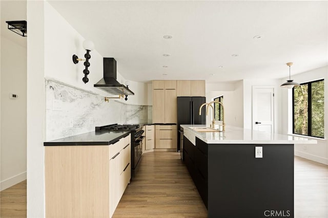30260 Gremlin Ct, Running Springs, CA 92382 - kitchen with range hood, light brown cabinetry, modern cabinets, black appliances, and decorative backsplash