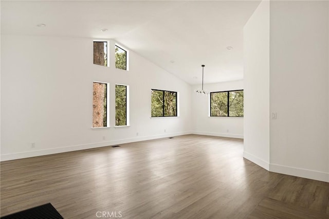 30260 Gremlin Ct, Running Springs, CA 92382 - unfurnished living room with dark wood finished floors and high vaulted ceiling