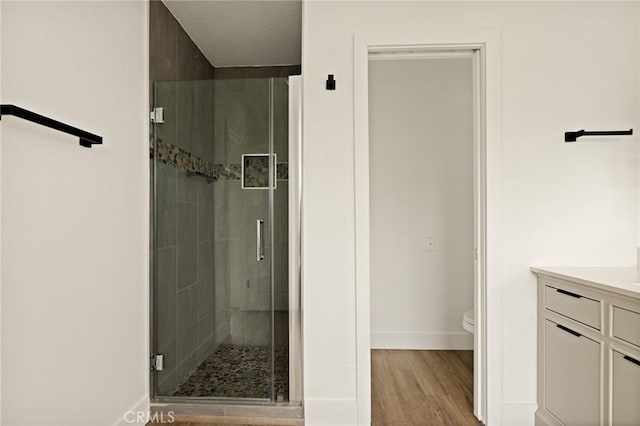 30260 Gremlin Ct, Running Springs, CA 92382 - full bath featuring a stall shower, vanity, and wood finished floors