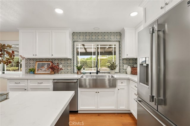 1917 N Quince Way, Upland, CA 91784 - kitchen featuring stainless steel appliances, light wood-type flooring, light countertops, backsplash, and recessed lighting