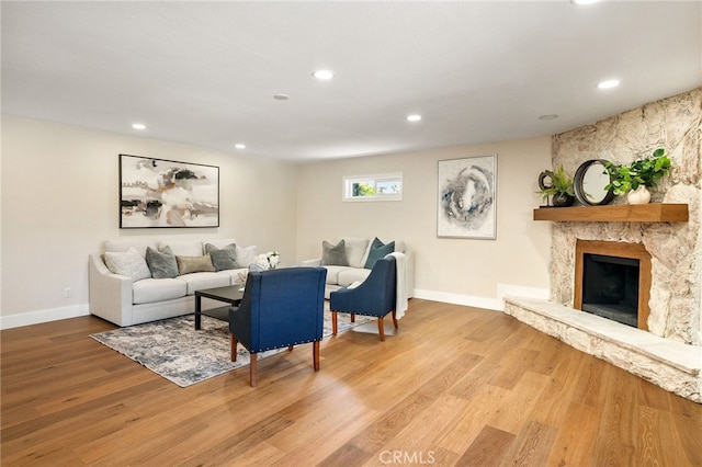 1917 N Quince Way, Upland, CA 91784 - living room featuring wood finished floors, recessed lighting, and a stone fireplace