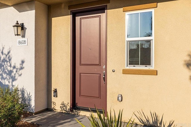 8608 Amherst St, Santee, CA 92071 - doorway to property with stucco siding