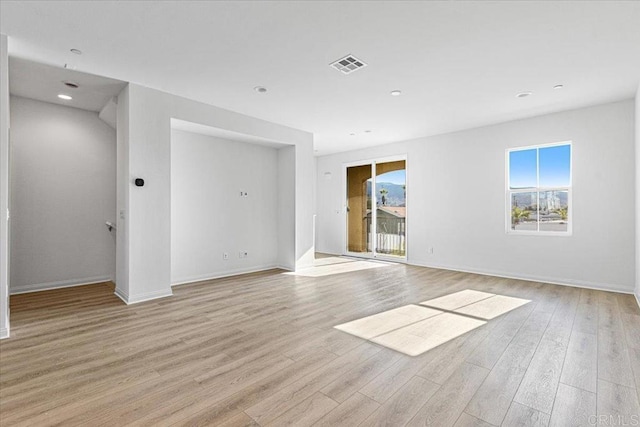 8608 Amherst St, Santee, CA 92071 - empty room with light wood-style floors and recessed lighting