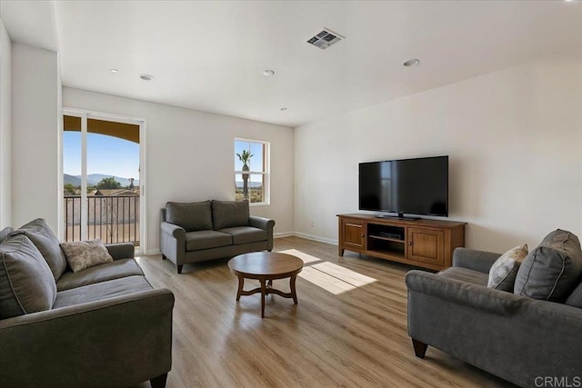 8608 Amherst St, Santee, CA 92071 - living area featuring light wood finished floors and recessed lighting