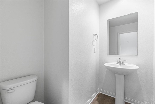 8608 Amherst St, Santee, CA 92071 - half bathroom with toilet and wood finished floors